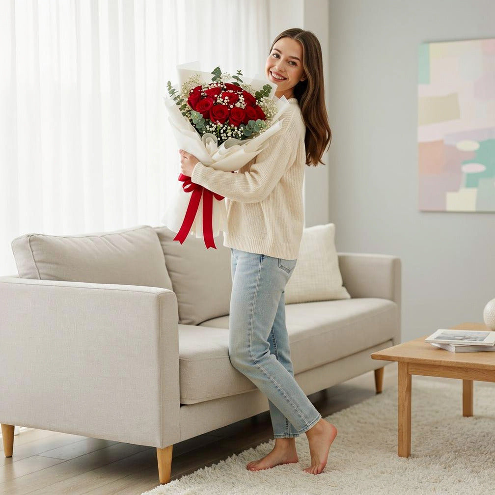 12 Red Rose Bouquet for Anniversary held by a model, view 2