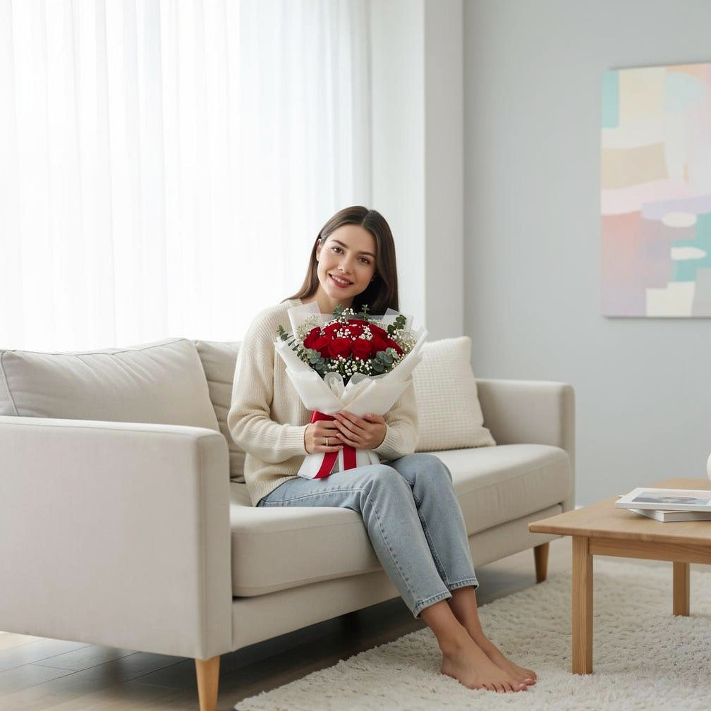12 Red Rose Bouquet for Anniversary held by a model, view 3