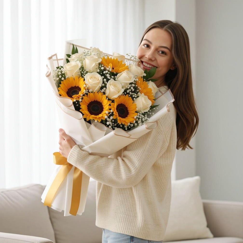 12 White Roses & 5 Sunflowers Bouquet for Birthday held by a model, view 1