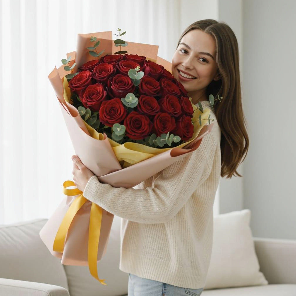 15 Red Roses Bouquet for Anniversary held by a model, view 1