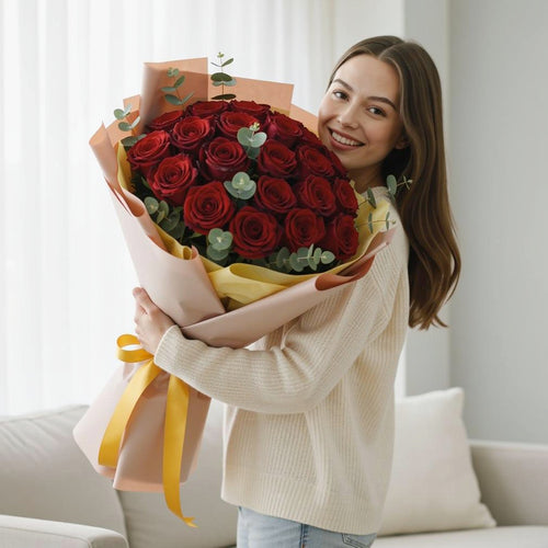 15 Red Roses Bouquet for Anniversary held by a model, view 1