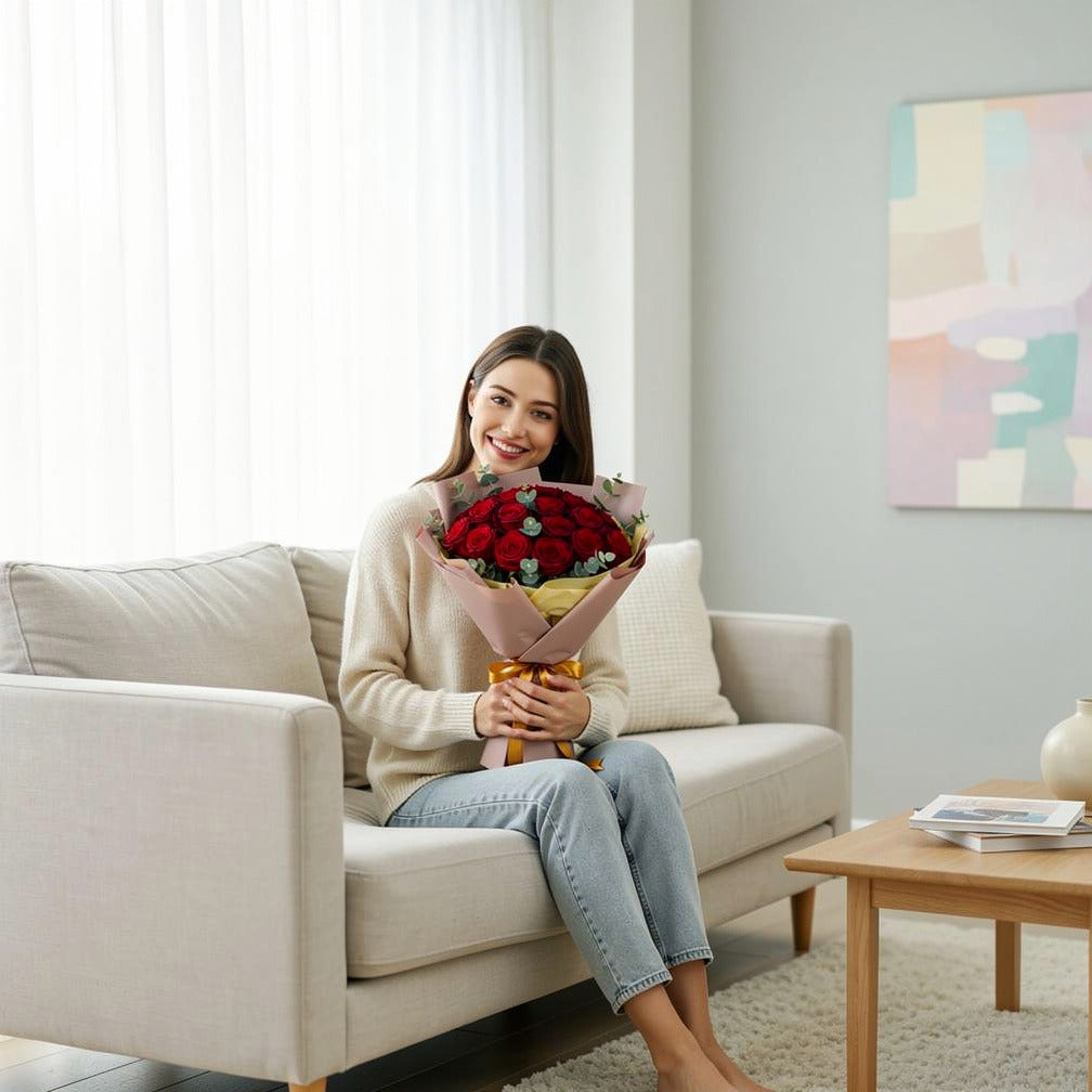 15 Red Roses Bouquet for Anniversary held by a model, view 3