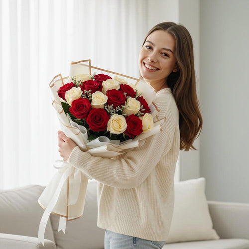 16 Red & White Rose Bouquet for Anniversary held by a model, view 1