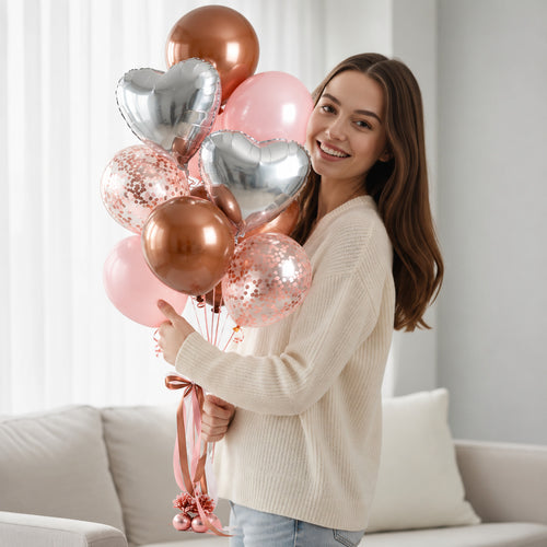 2 Brown & 2 Pink Helium Balloons with 2 Silver Heart Balloons & 3 Pink Confetti Balloons held by a model, view 1