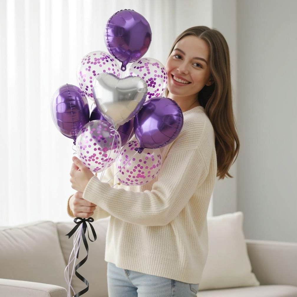 2 Purple Foil Balloons with 2 Silver Heart-Shaped Foil Balloons & 3 Purple Confetti Balloons held by a model, view 1