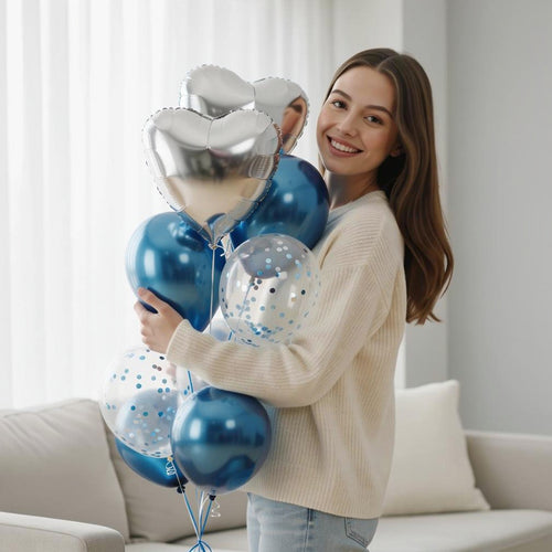 2 Silver Heart & 3 Blue Round Helium Foil Balloons with 3 Blue Confetti Balloons held by a model, view 1