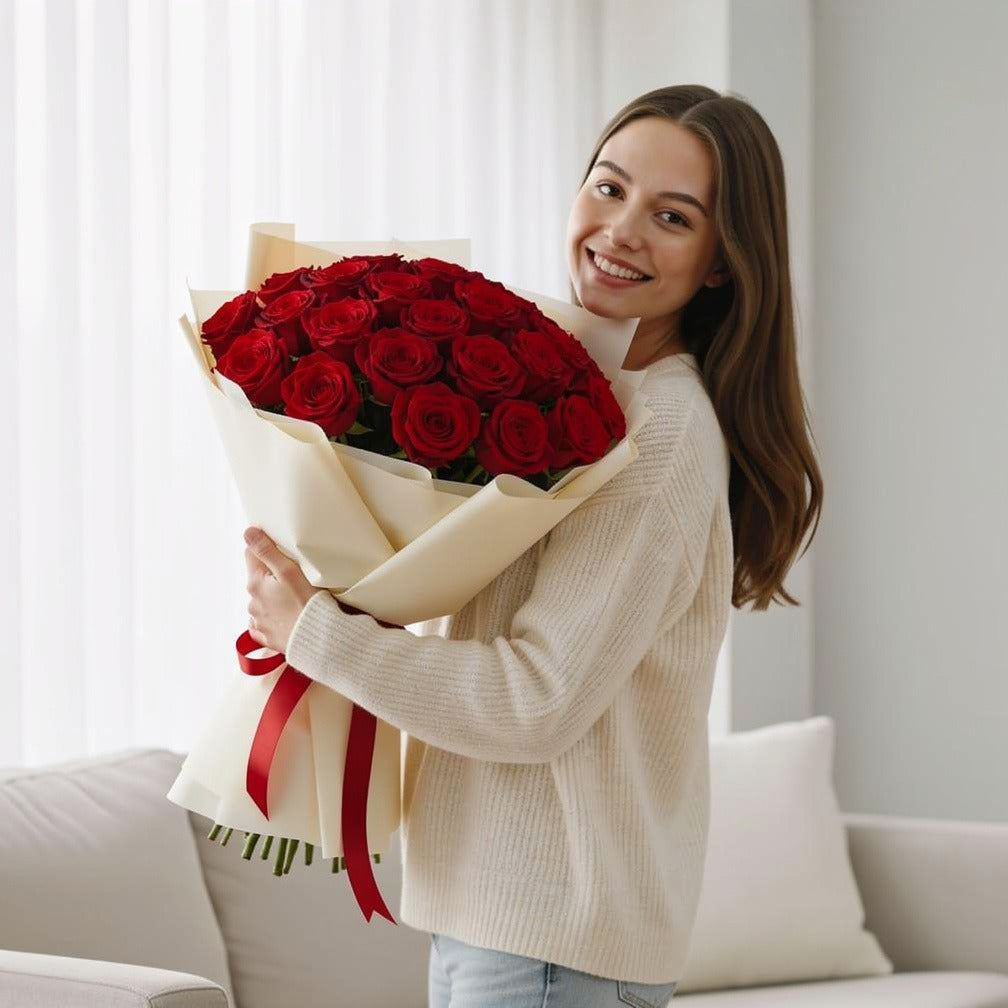 30 Red Rose Bouquet for Anniversary held by a model, view 1