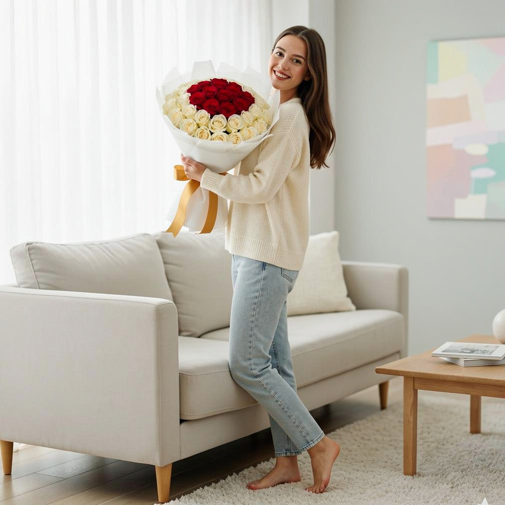 32 Red & White Rose Bouquet for Anniversary held by a model, view 2