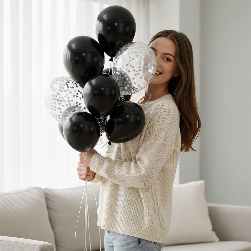 4 Black & 2 Silver Round Helium Foil Balloons with 4 Silver Confetti Balloons held by a model, view 1
