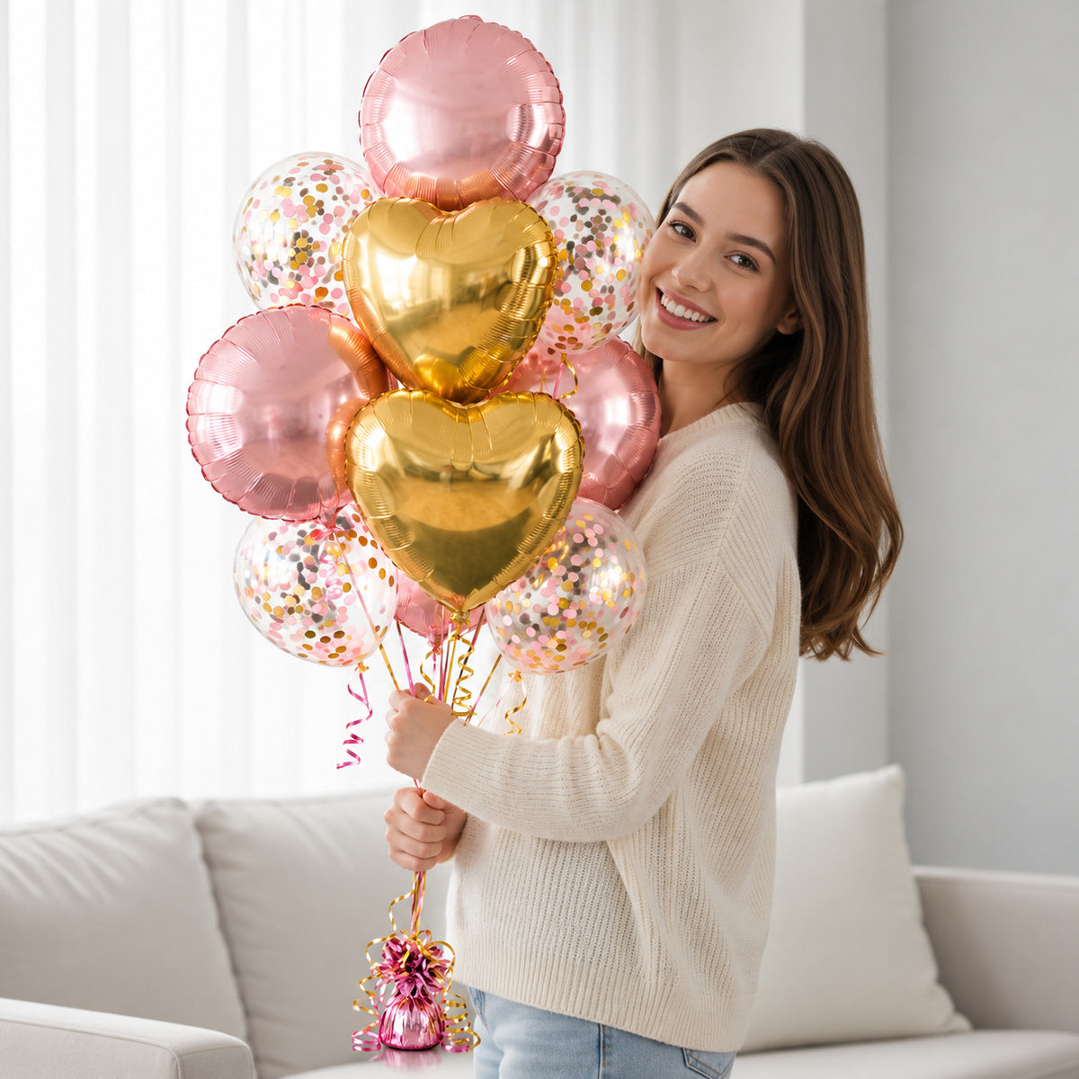 4 Pink Round Balloons with 2 Golden Heart Foil Balloons & 4 Pink Confetti Balloons held by a model, view 1