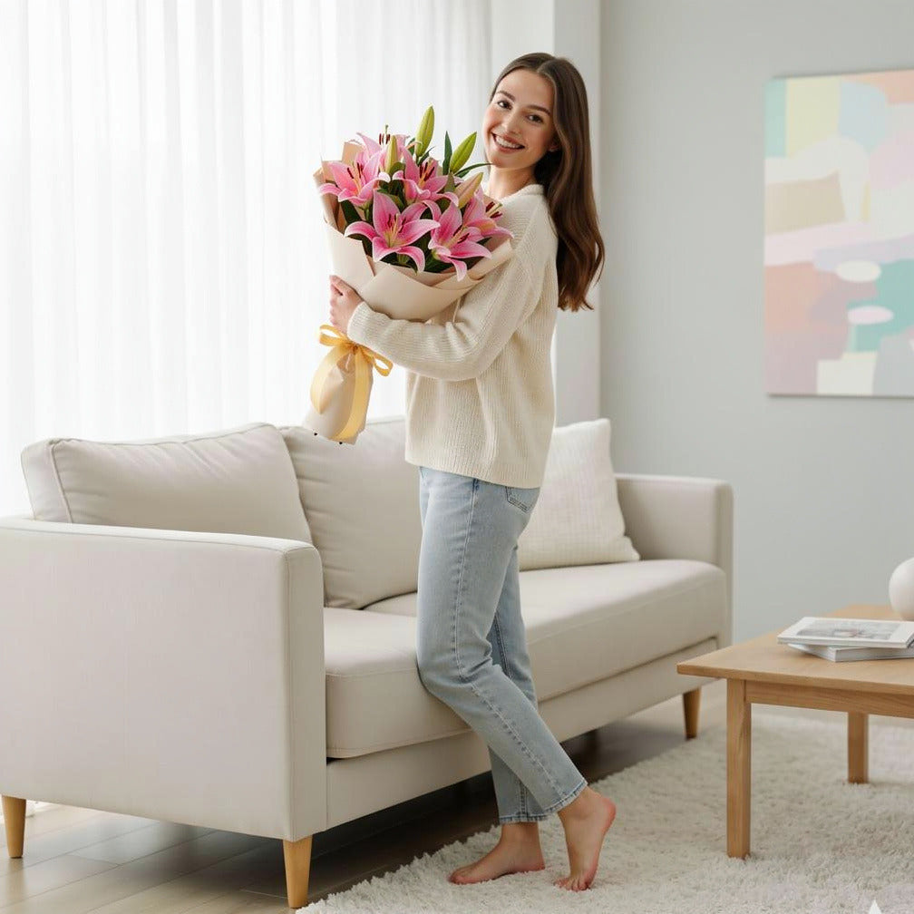 7 Pink Lilies Bouquet for Birthday held by a model, view 2