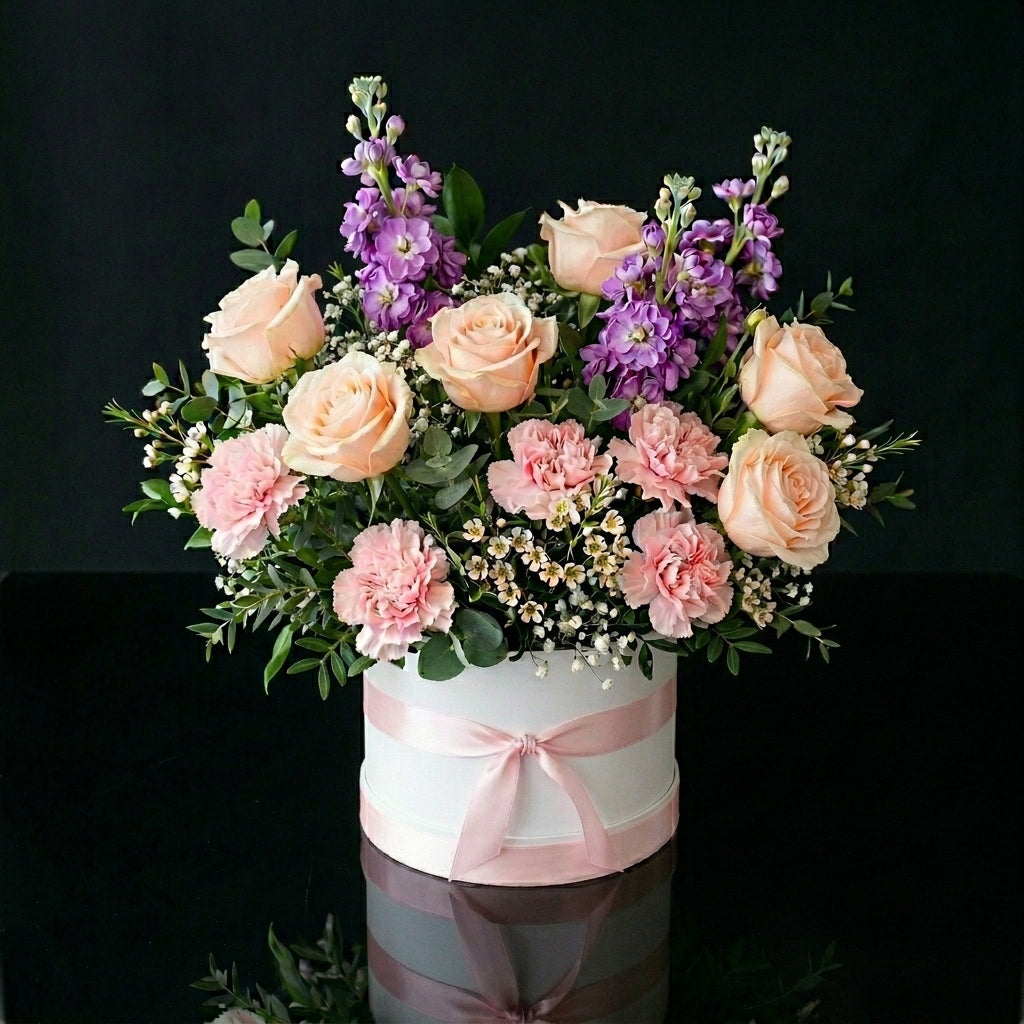Elegant White Round Flower Box with Peach Roses, Pink Carnations & Purple Matthiola bloomsandbeansae