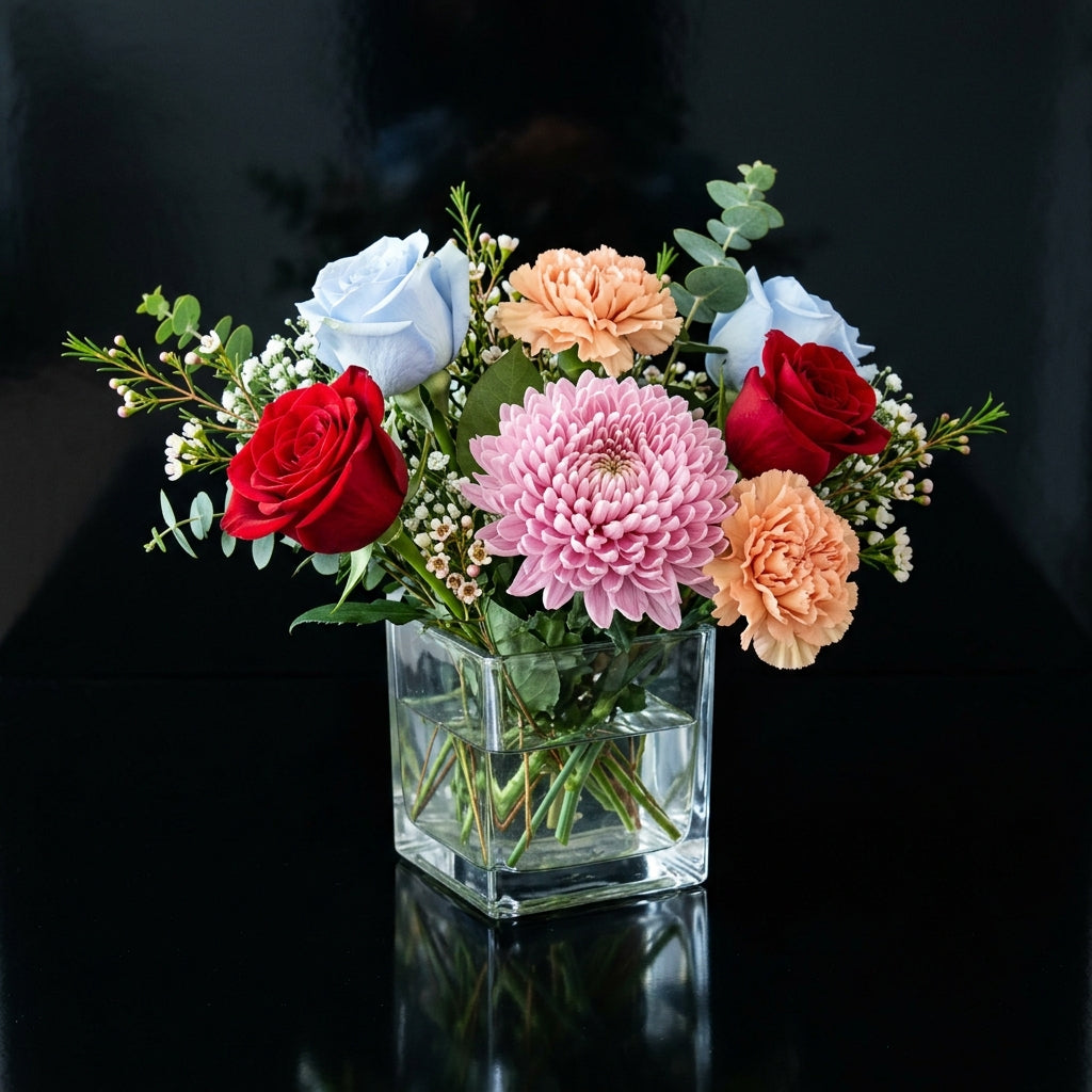 Stylish Small Square Vase with Blue, Red Roses & Mixed Blooms bloomsandbeansae