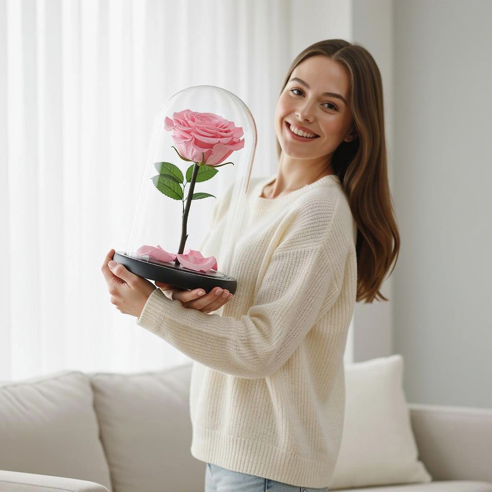 Baby Pink Medium Preserved Rose held by a model, view 1