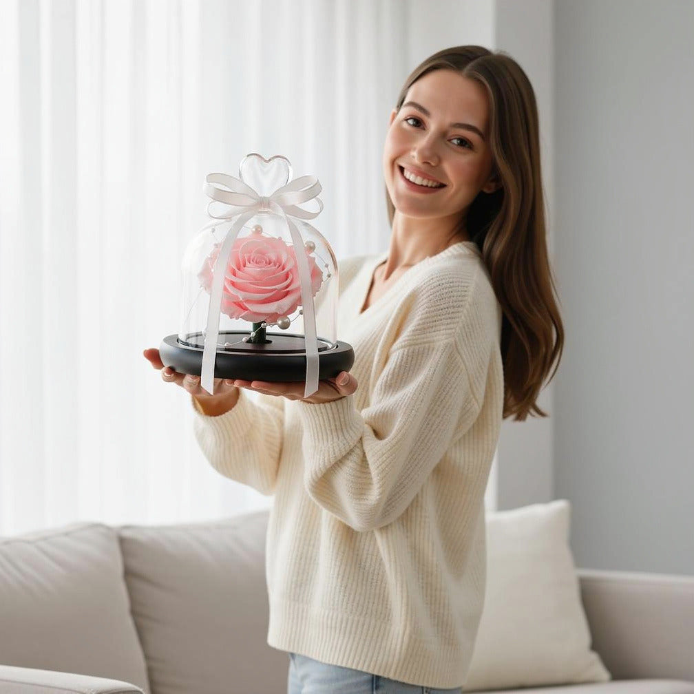Baby Pink Small Preserved Rose held by a model, view 1