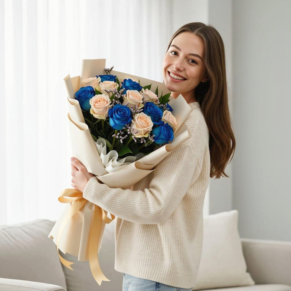 Blue & Peach Roses Graduation Bouquet held by a model, view 1