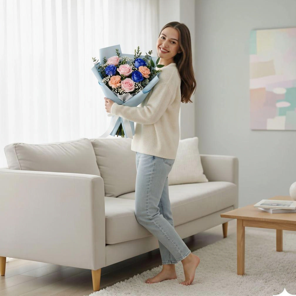 Bouquet of Pink & Blue Roses with Peach Carnations for Father’s Day held by a model, view 2