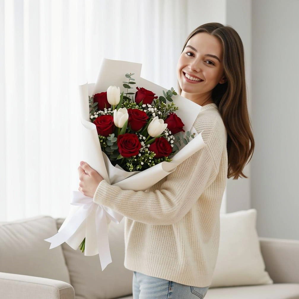 Bouquet of Red Roses & White Tulips For Eid held by a model, view 1