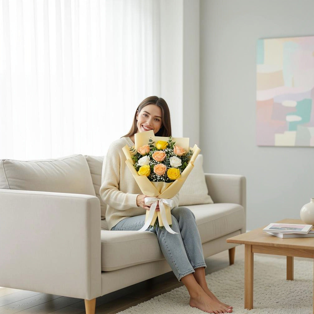 Eid Bright Bouquet of Yellow, White & Peach Roses held by a model, view 3