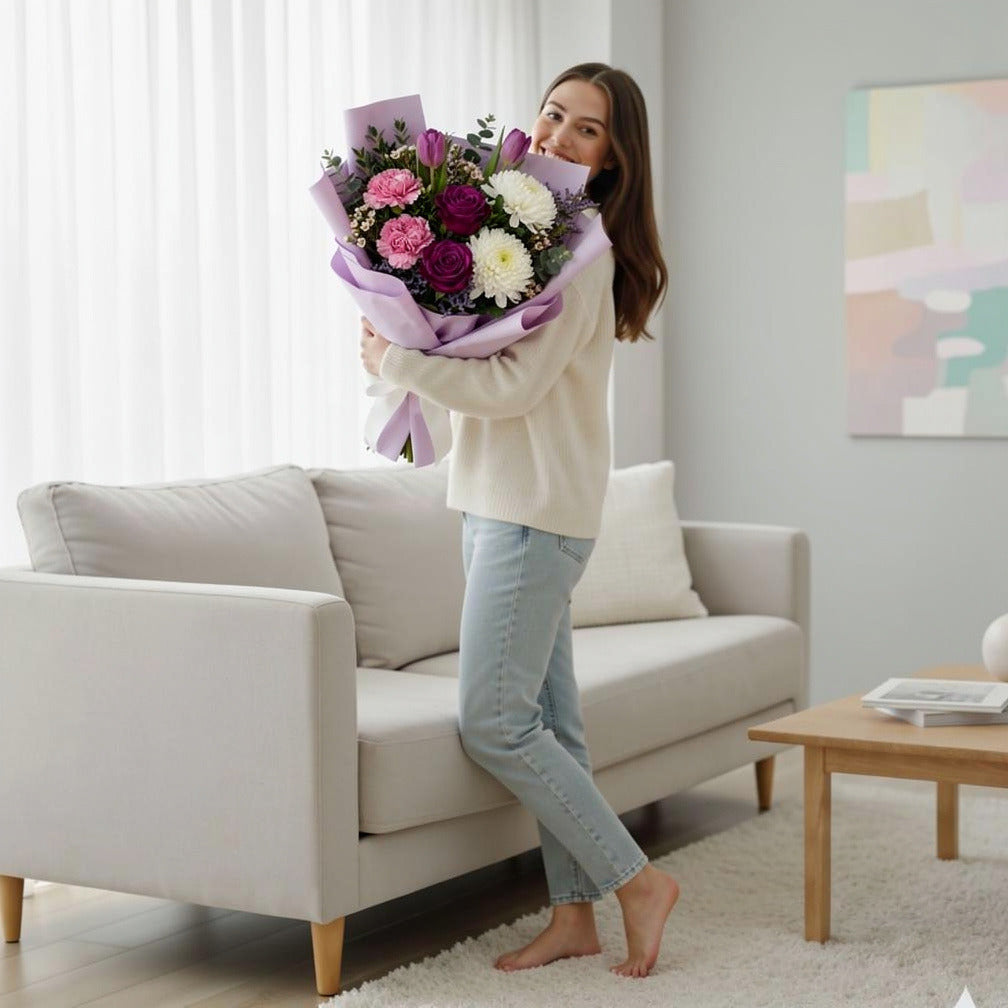 Eid Delight Bouquet of Purple Roses, Tulips & Carnations held by a model, view 2