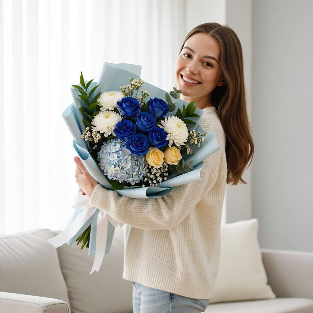 Eid Royal Bouquet of Blue, Yellow Roses & Hydrangea held by a model, view 1