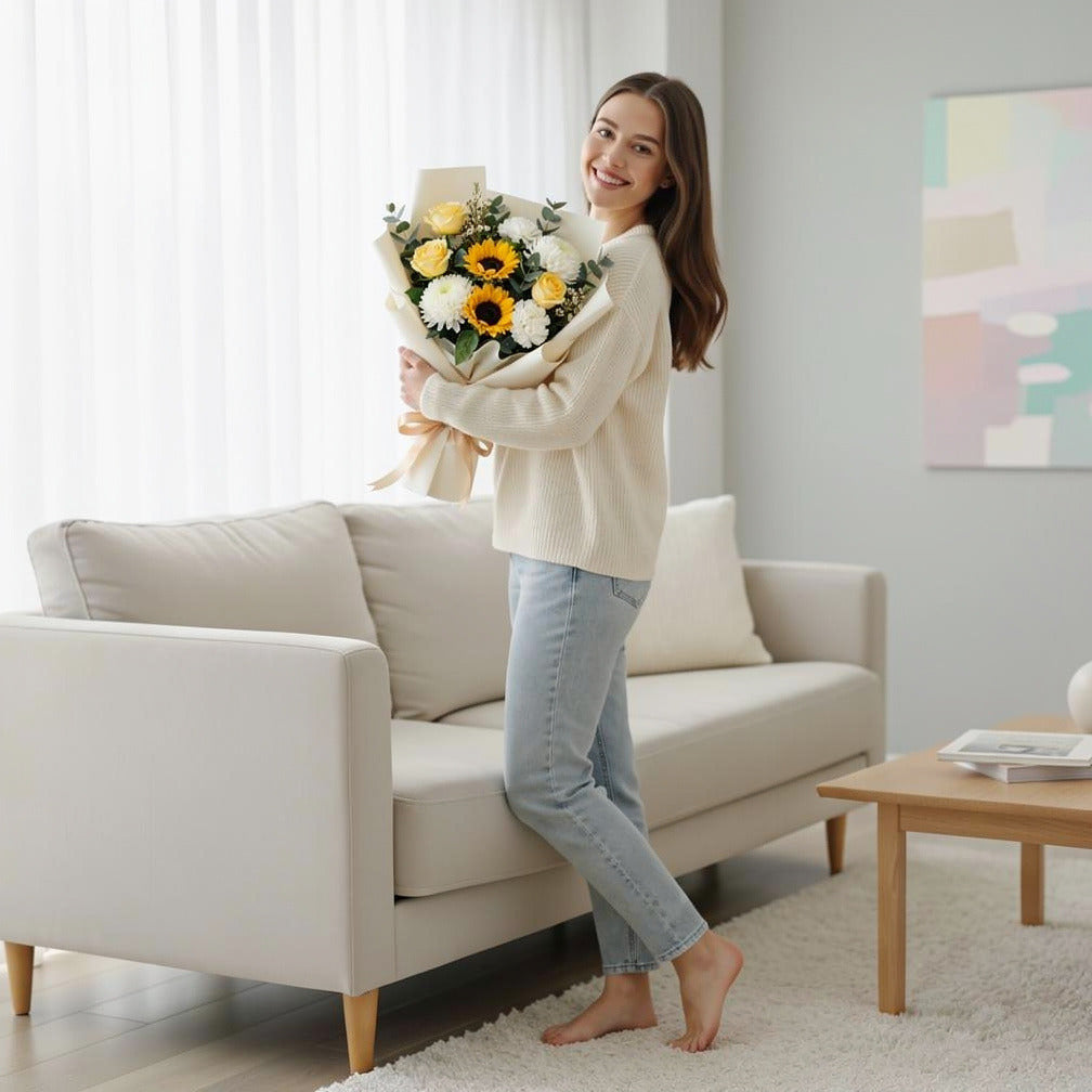 Eid Sunshine Bouquet of Yellow Roses, Chrysanthemum & Sunflowers held by a model, view 2