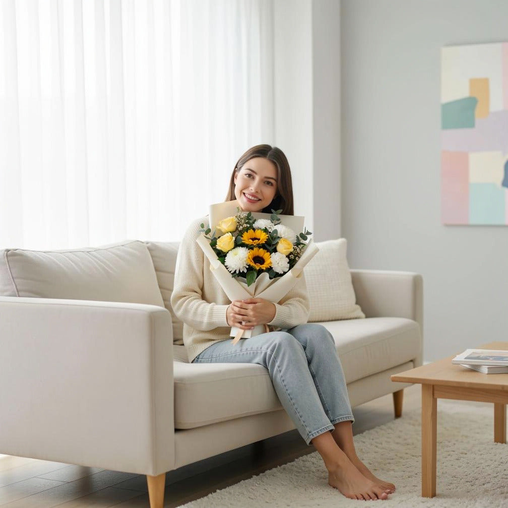 Eid Sunshine Bouquet of Yellow Roses, Chrysanthemum & Sunflowers held by a model, view 3