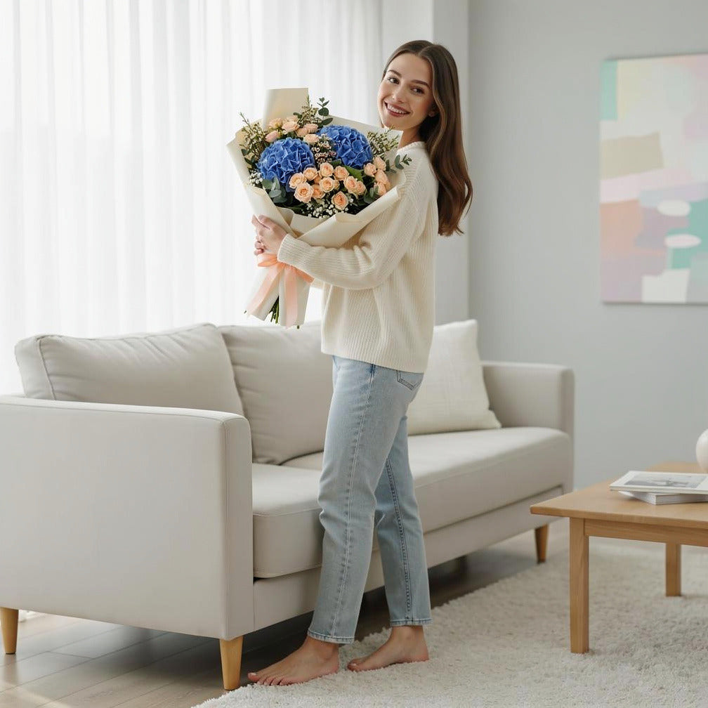 Elegant Blue Hydrangea & Peach Baby Rose Bouquet held by a model, view 2