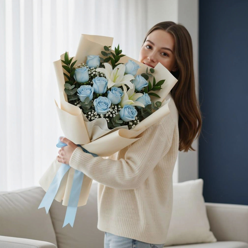 Elegant Bouquet of 10 Blue Roses & White Lilies for Father’s Day held by a model, view 1