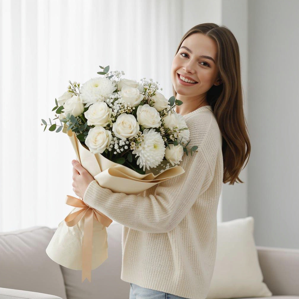 Elegant Bridal Bouquet of White Roses & Chrysanthemums held by a model, view 1