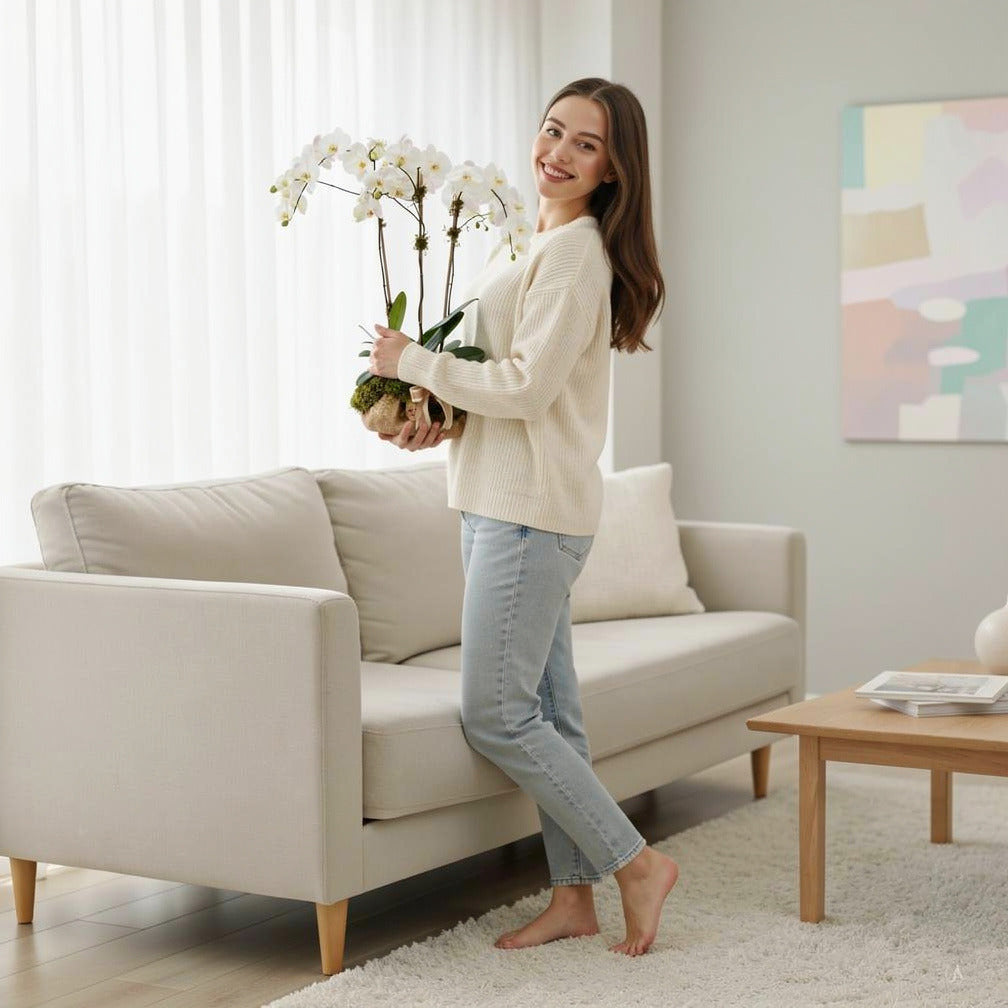Elegant Trio White Orchids held by a model, view 2
