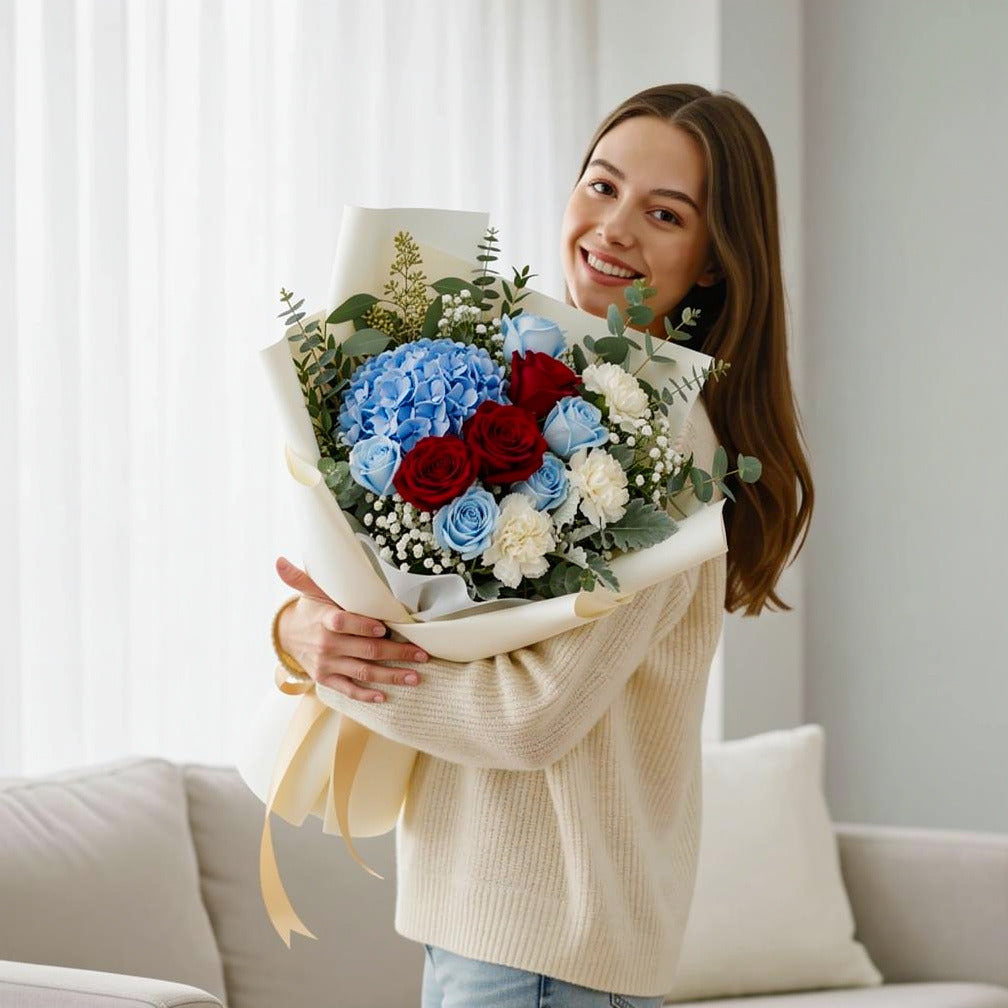 Father’s Day Blue & Red Roses Bouquet with Hydrangea held by a model, view 1