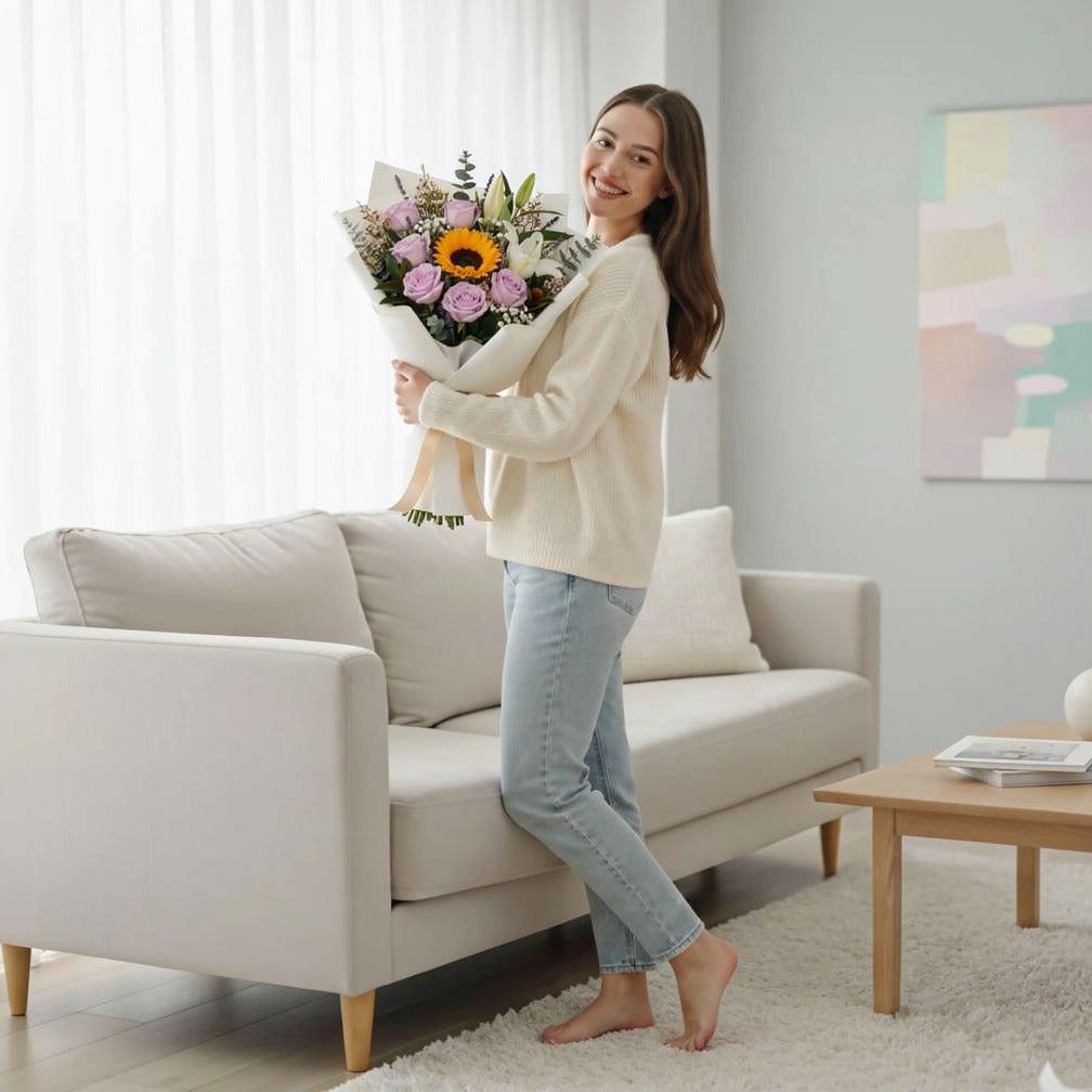 Fresh Purple Roses, White Lilies & Sunflower Bouquet for Father’s Day held by a model, view 2