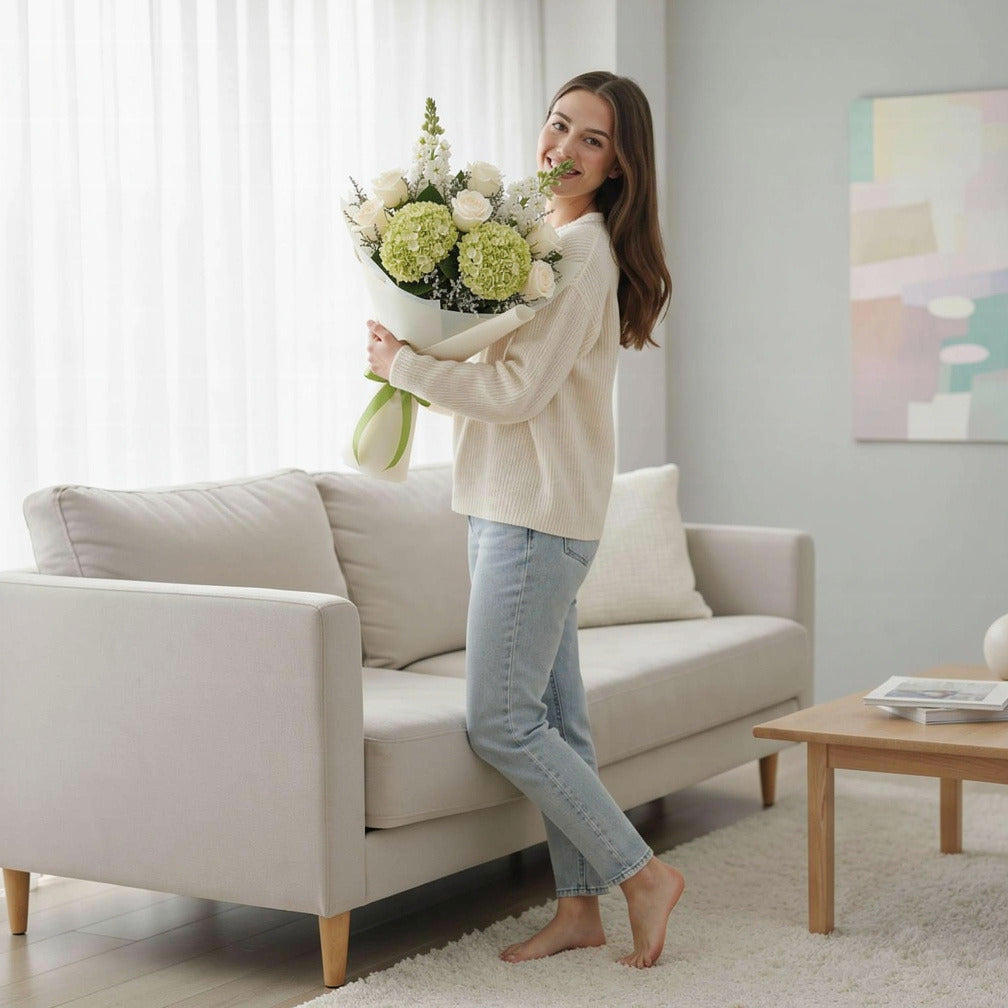 Green Hydrangea & White Roses Graduation Bouquet held by a model, view 2