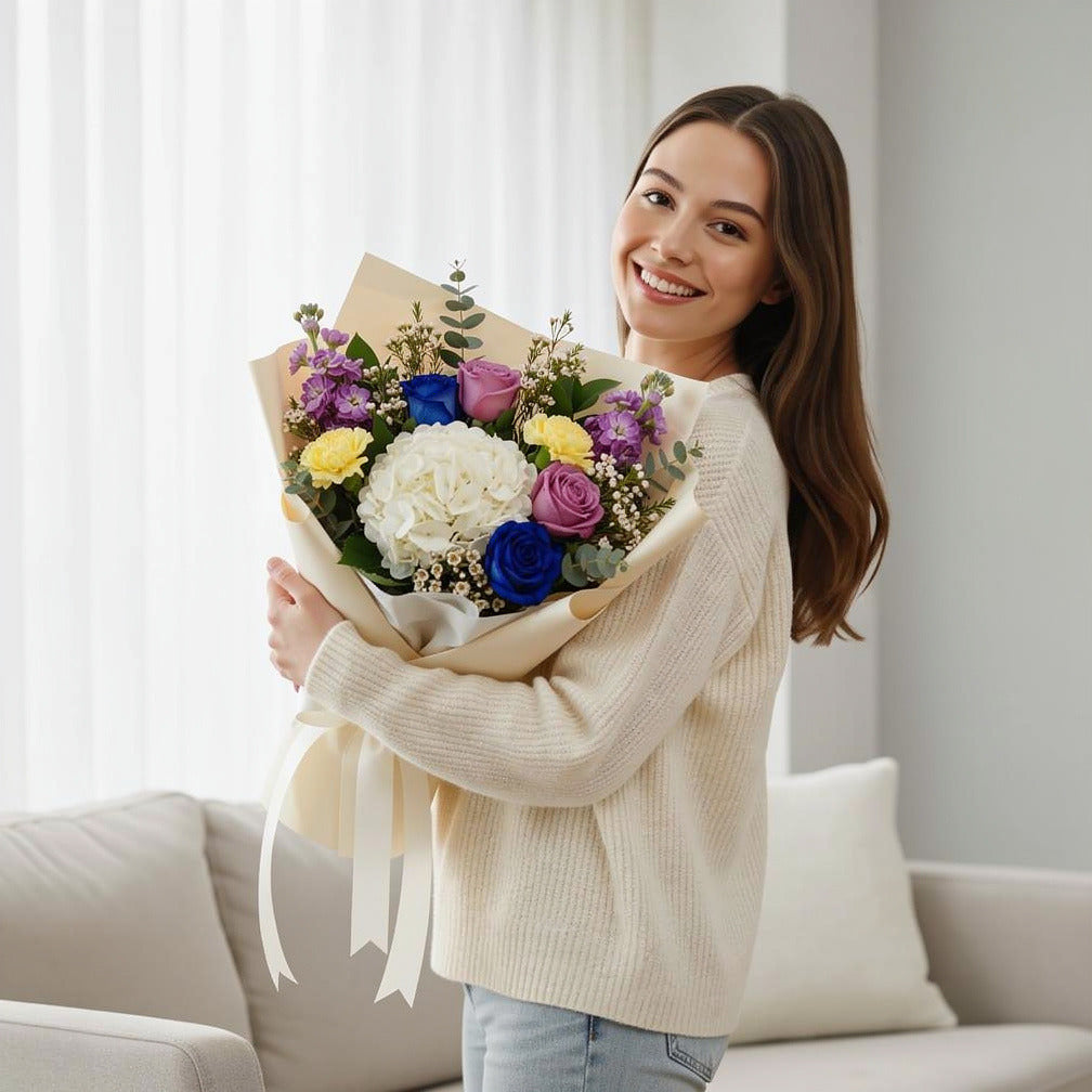 Luxe Bouquet of Purple, Blue Roses & Hydrangea held by a model, view 1