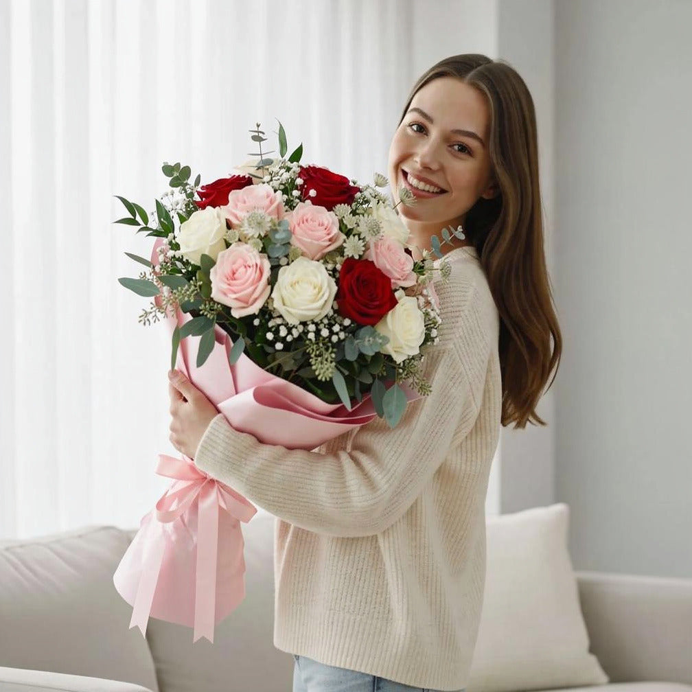 Luxurious Bridal Bouquet of Red, White & Pink Roses held by a model, view 1