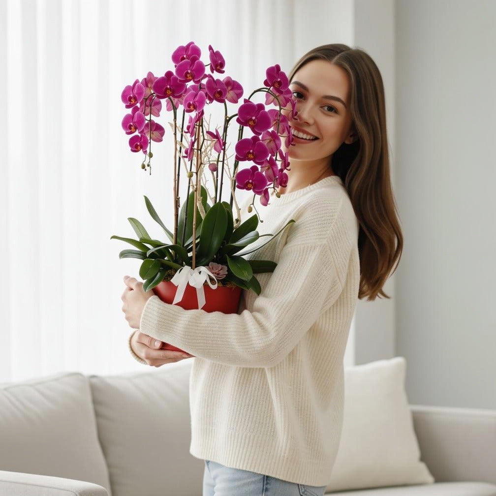 Luxury 7 Purple Orchids held by a model, view 1