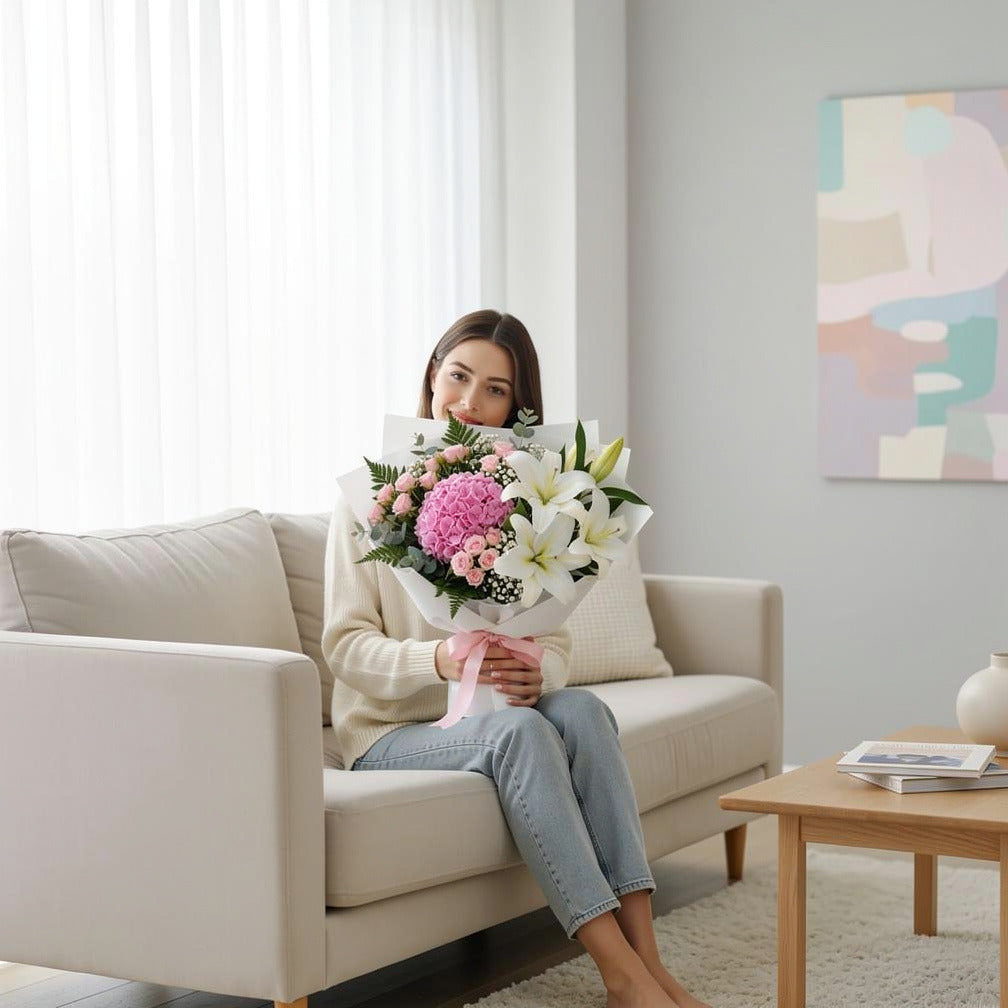 Mother’s Day Soft Pink Hydrangea & Lily Bouquet held by a model, view 3