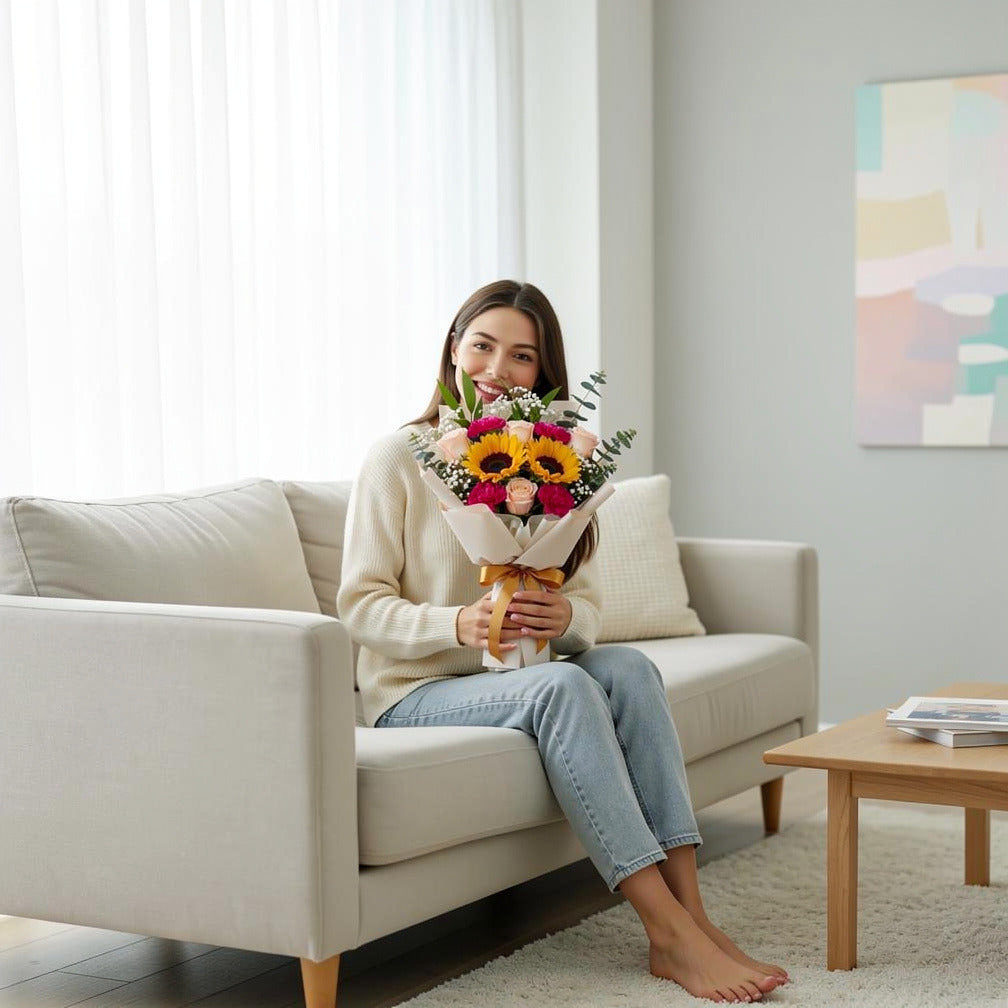 Peach Roses & Mixed Blooms Bouquet held by a model, view 3