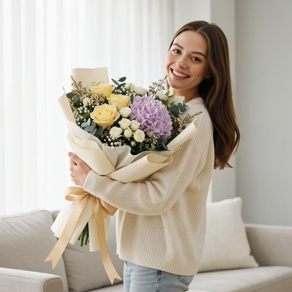 Purple Hydrangea & Yellow Rose Bouquet held by a model, view 1