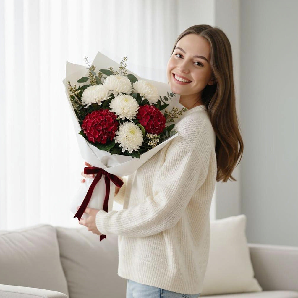 Romantic Red Hydrangea & White Rose Bouquet held by a model, view 1