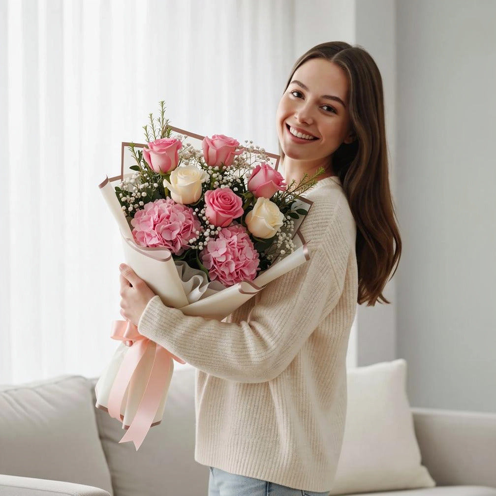 Roses & Hydrangeas Graduation Bouquet held by a model, view 1