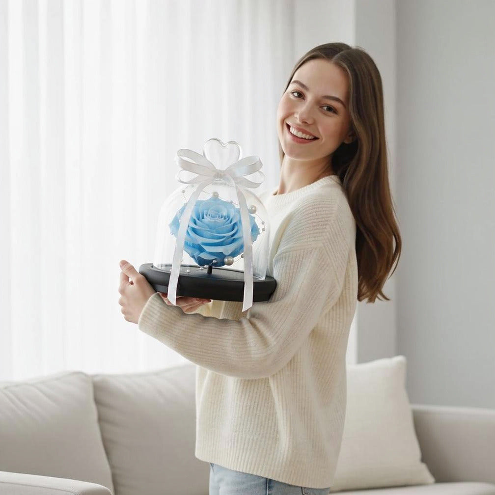 Sky Blue Small Preserved Rose held by a model, view 1