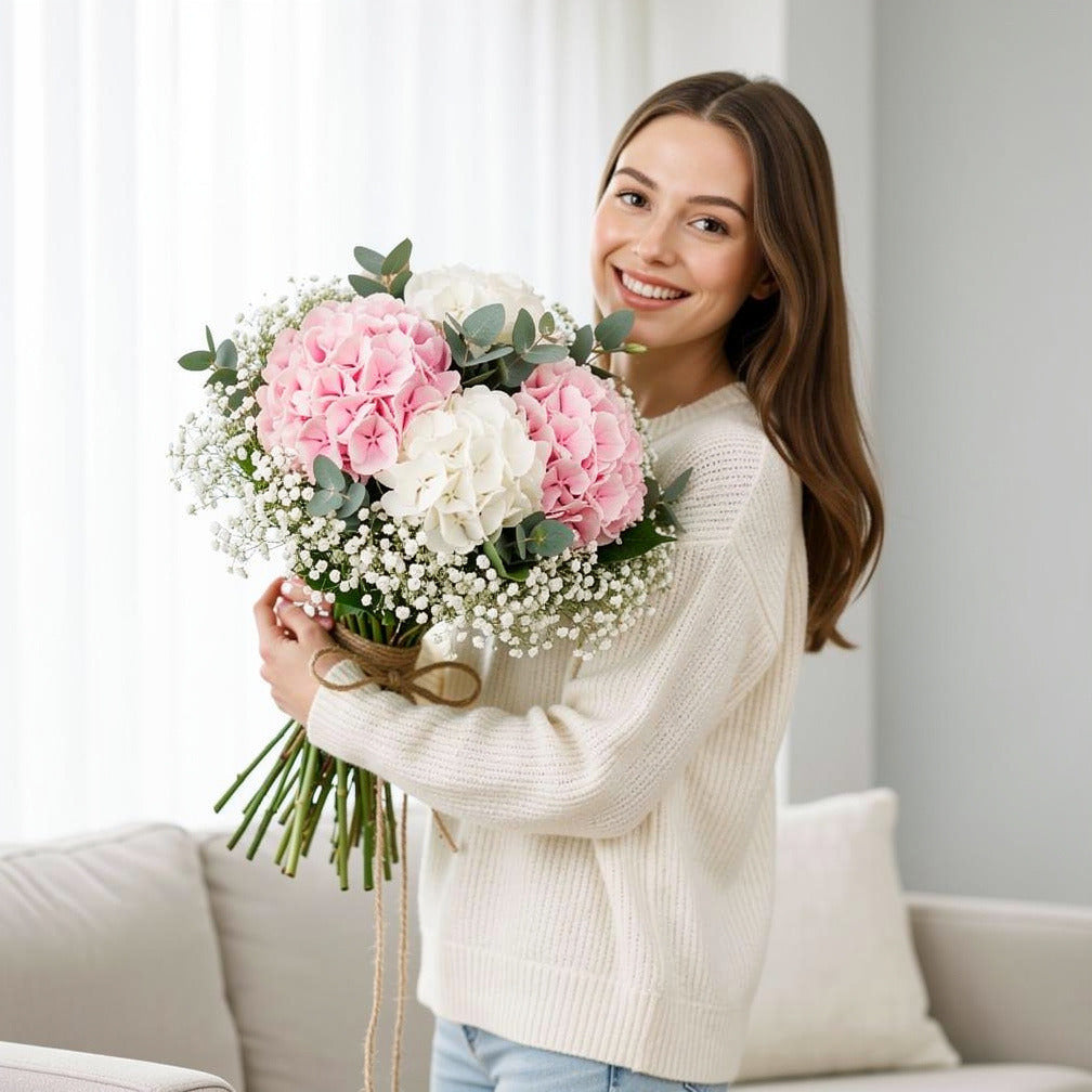 Soft Bridal Bouquet of Pink & White Hydrangeas held by a model, view 1