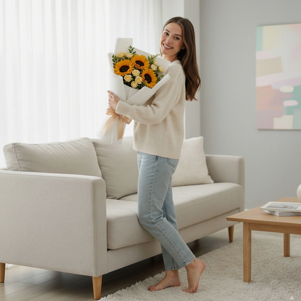 Sunny Sunflower & Yellow Baby Rose Bouquet held by a model, view 2