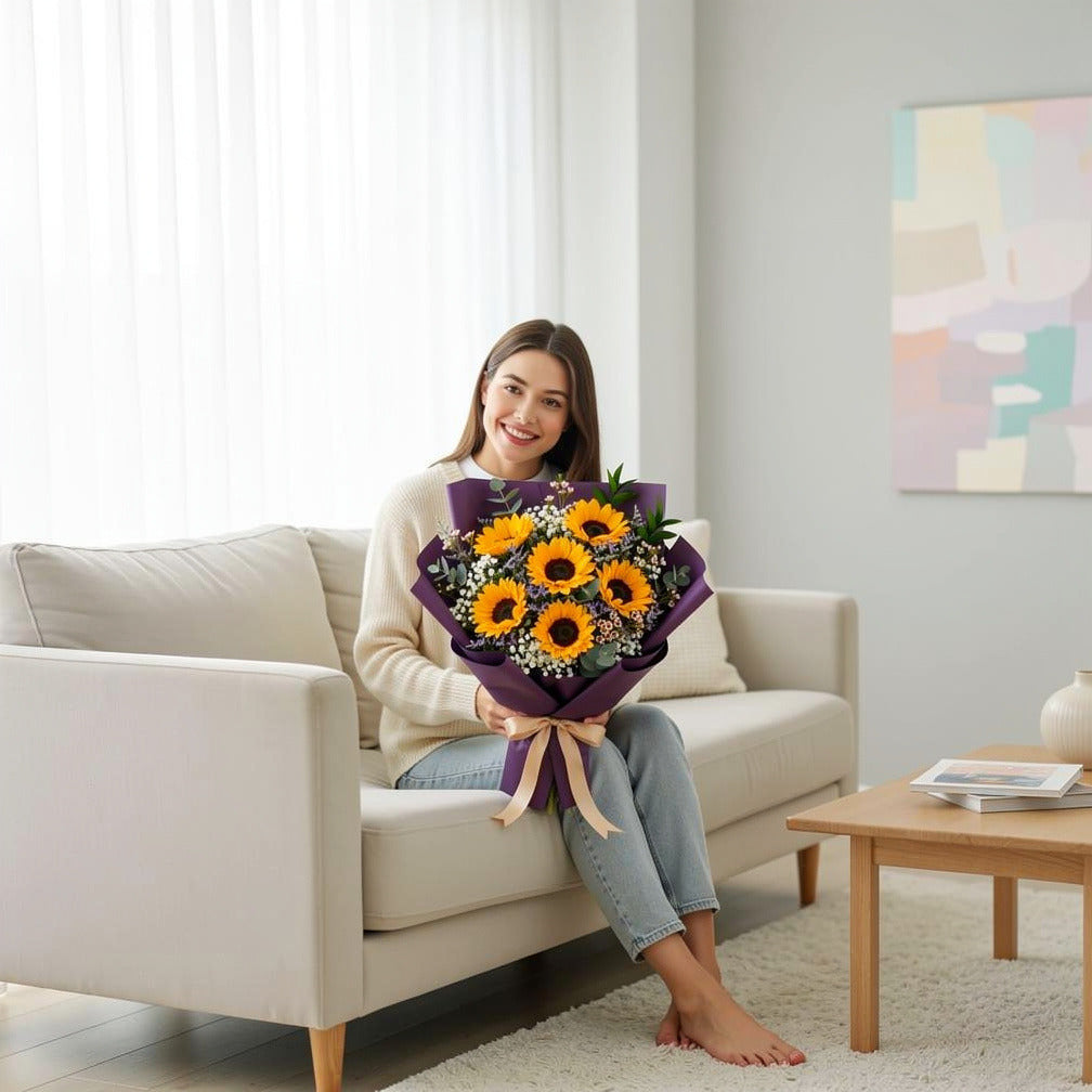 Sunshine Eid Bouquet of 6 Sunflowers held by a model, view 3