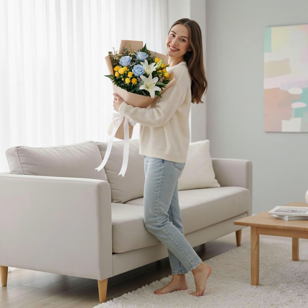 Teacher’s Day Calm Blue & White Lily Mixed Bouquet held by a model, view 2