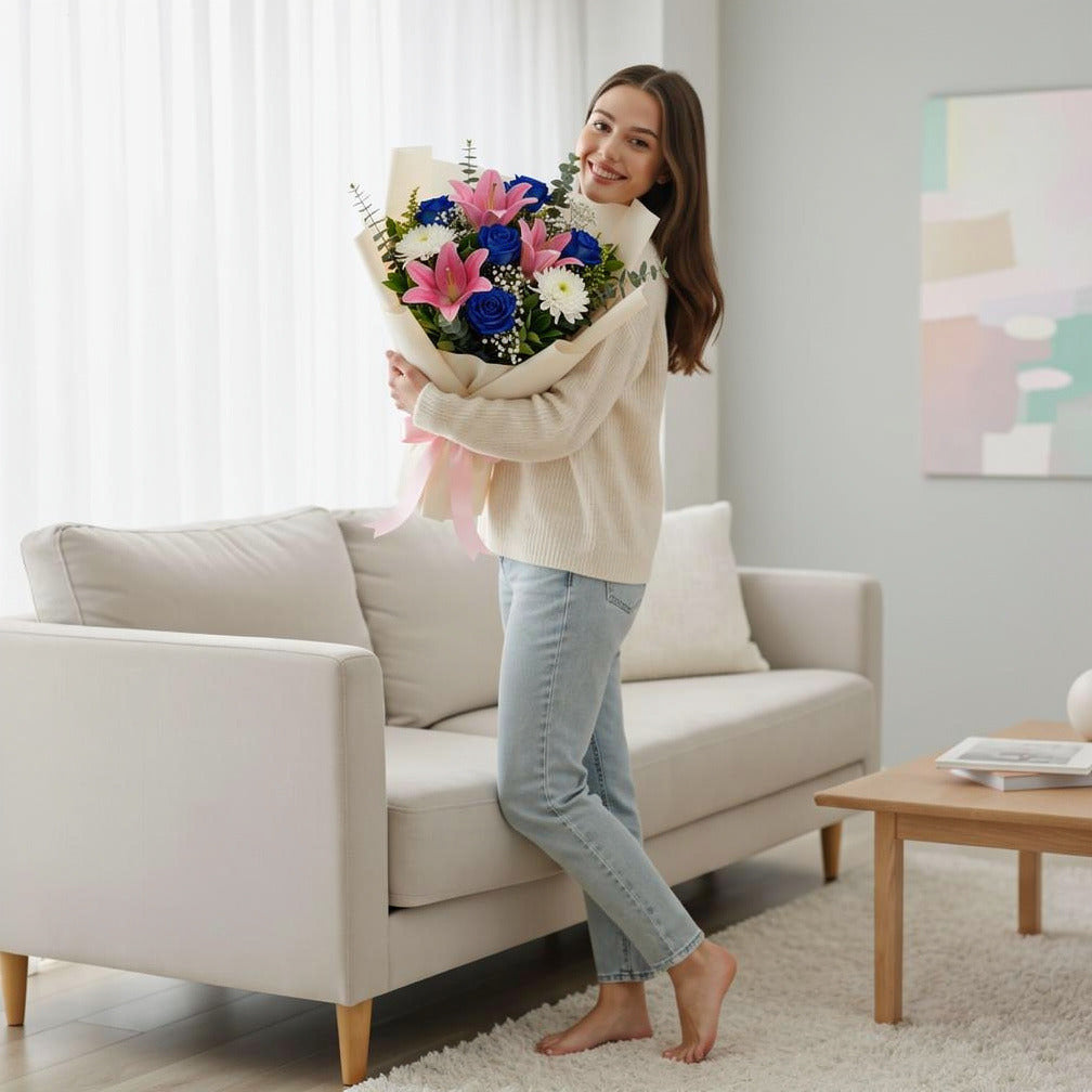 Teacher’s Day Elegant Blue Rose & Pink Lily Bouquet held by a model, view 2