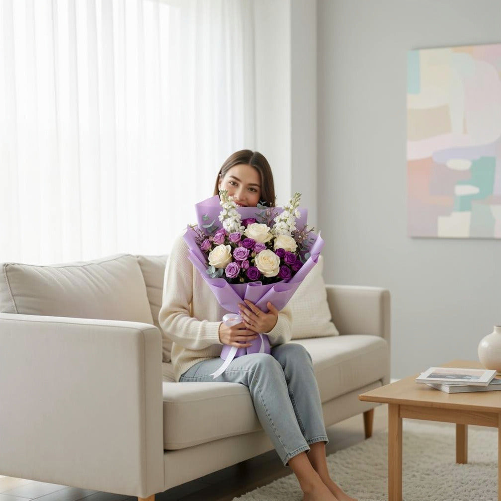 Teacher’s Day Elegant White & Purple Floral Bouquet held by a model, view 3