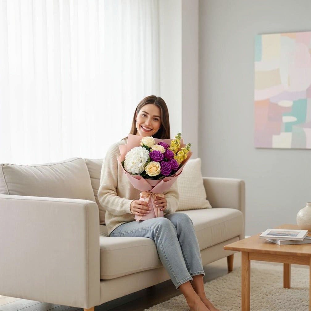 Women’s Day Bright Yellow & Purple Hydrangea Rose Bouquet held by a model, view 3